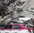 图为墨西哥城一辆出租车被倒塌的建筑压扁。 - News.Cntv.Cn