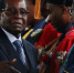 据外媒报道，自11月15日津巴布韦政局突变后，总统穆加贝首度公开露面，他11月17日在首都哈拉雷出席了一场毕业典礼仪式。津巴布韦近日政局突变，该国军方15日宣布采取行动，控制总统穆加贝及其家人，但否认发动“政变”。穆加贝据称被软禁在私人官邸“蓝宫”，但拒绝下台，坚持要完成当前任期。有消息显示，军方将领正计划组成过渡政府，推举上周被撤职的前副总统姆南加古瓦任临时领导人，多名反对派领袖已获邀请加入政府。11月16日，津巴布韦总统穆加贝与津国防军司令康斯坦丁·古韦亚·奇文加见面并会谈。 - News.Cntv.Cn